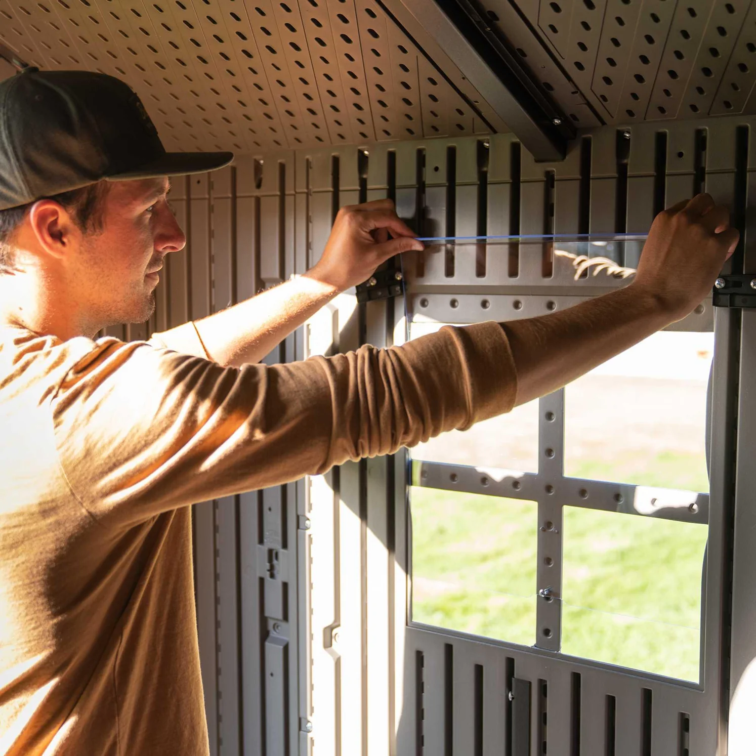 Lifetime_-_60370_8_Ft._X_7.5_Ft._Outdoor_Storage_Shed_man_interacting_with_window_1494x1494